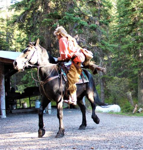 Buckskin Climbing Off His Horse