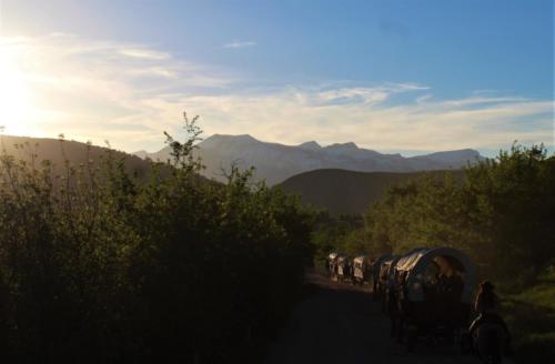 Wagons Headed Down Cache Creek Canyon At The End Of The Day